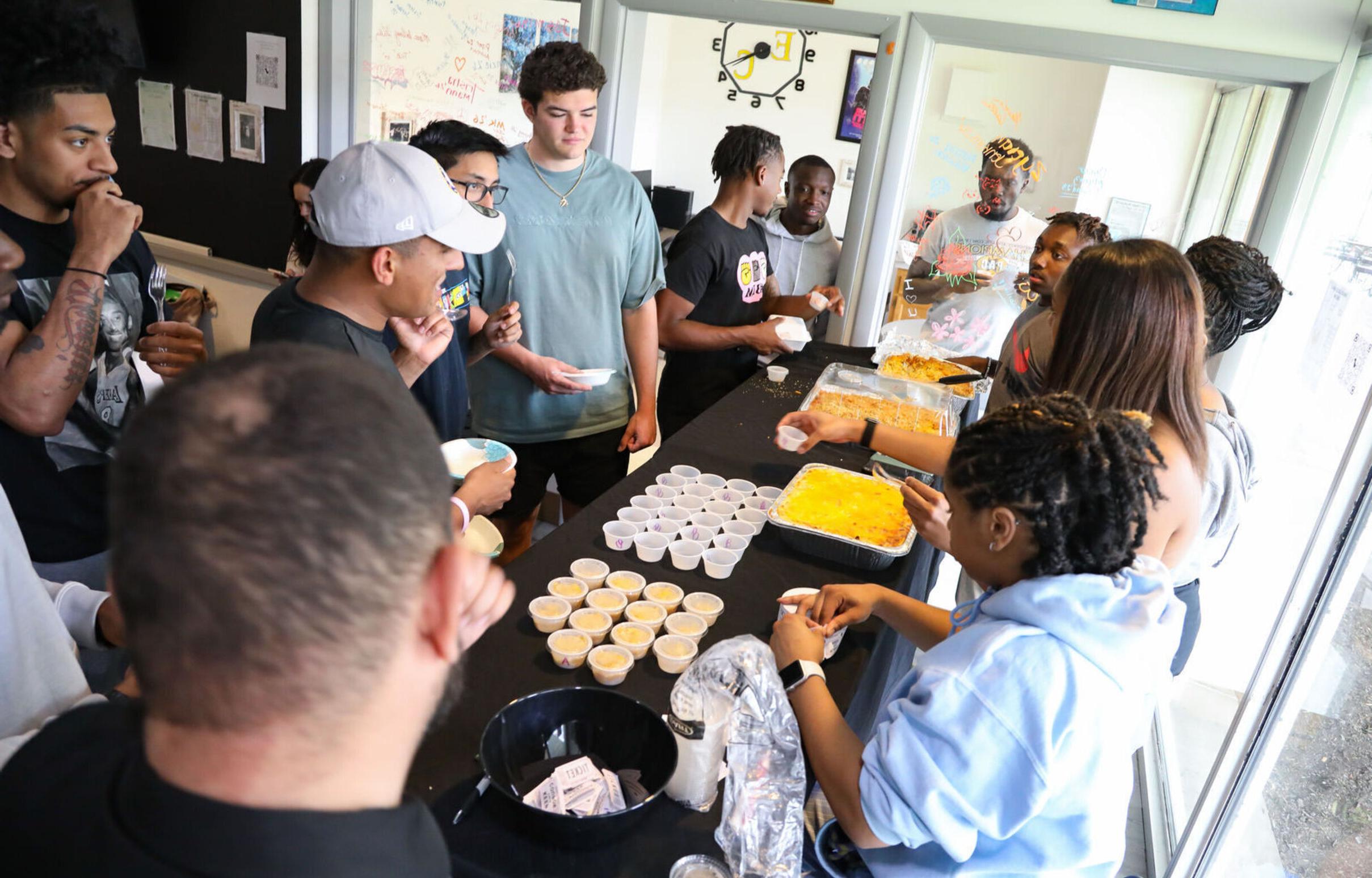 People try samples of macaroni and cheese during the BSU's Mac Off